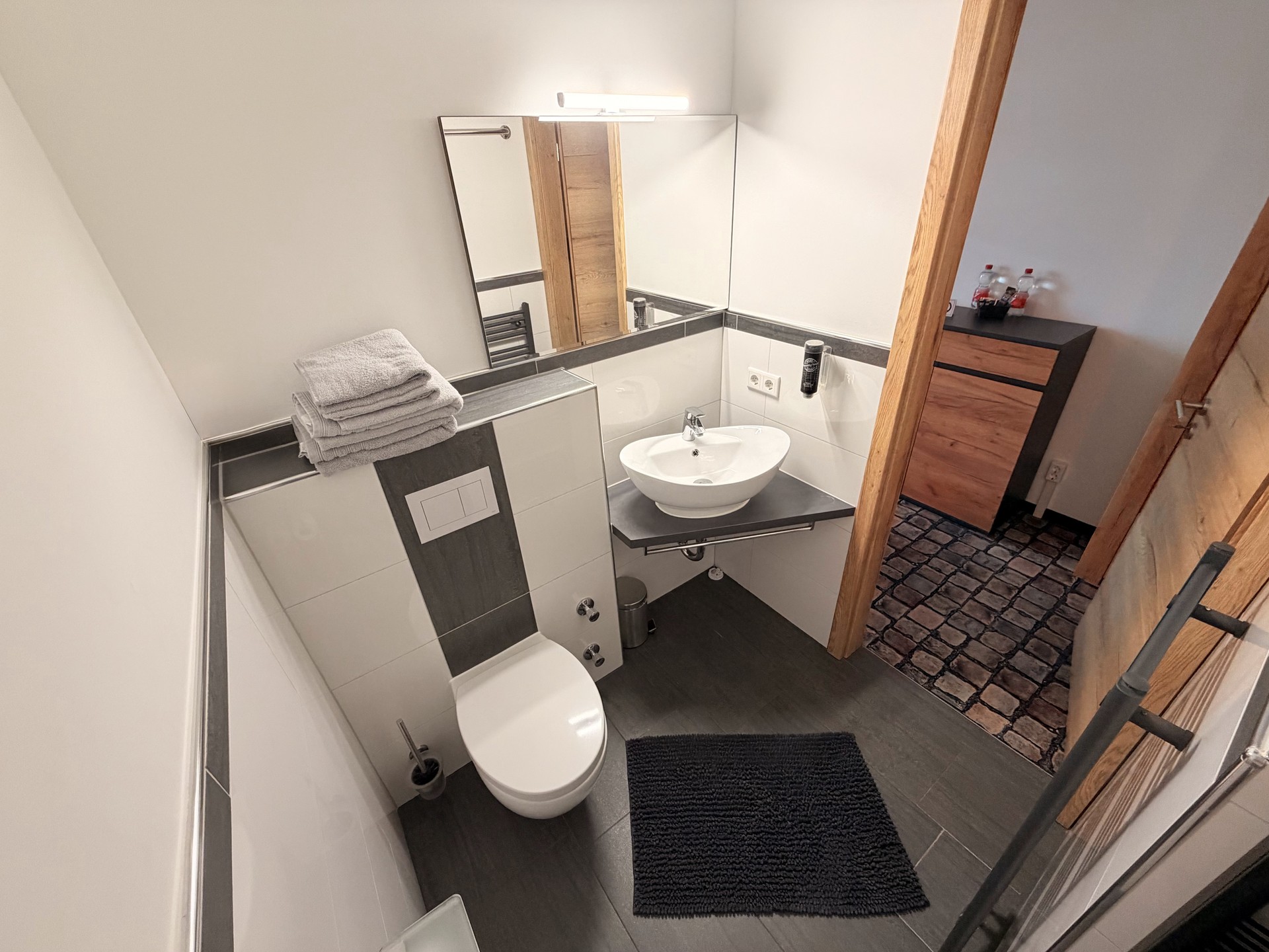Badezimmer im Studio+ Zimmer